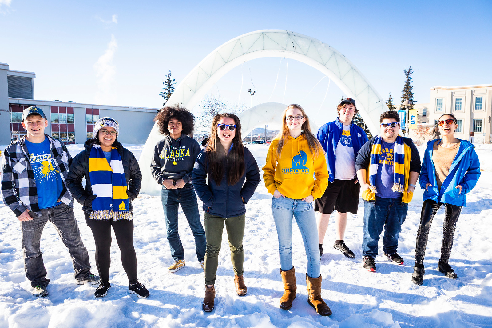 UAF Students standing in front of Ice Arch. 